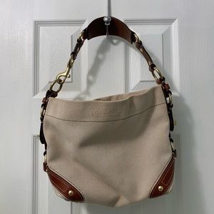 Coach canvas bag with leather trim and handles.